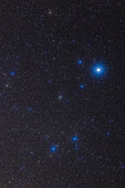 A portrait of the constellation of Lyra the Harp from May 2023,with a 135mm telephoto lens to frame this small pattern. Vega is the bright star and the double star to the left of Vega is Epsilon Lyrae. The colourful small group below it is the sparse star cluster Stephenson 1 surrounding the stars Delta1 and Delta2 Lyrae. The globular cluster M56 is just in the lower left corner.