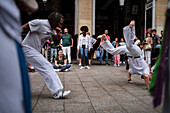 Members of Mestre Branco Capoeira Escola demonstrate in the street during the Fiestas of El Pilar in Zaragoza,Aragon,Spain