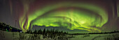 A 180° panorama of the aurora curtains across the northern sky,on February 22,2023,from the grounds northeast of the Churchill Northern Studies Centre,in Churchill,Manitoba. This was a Kp5 level aurora this night,active from twilight on and peaking here at about 9:30 pm. Polaris is at top just left of centre. Cassiopeia is at left,the Big Dipper at right.
