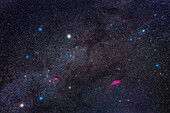 A framing of the northern winter sky constellations of Auriga (left) and Perseus (upper right). The Messier star clusters M36,M37 and M38 in Auriga show up well at lower left,along with the Flaming Star,IC 405,and other IC nebulas in Auriga. The large nebula at bottom right is NGC 1499,the California Nebula. The grouping of blue stars at upper right is the Perseus OB Association,aka Melotte 20. Mars is at lower left in Taurus,where it was on March 17,2023.