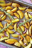 Potato wedges with rosemary and onions