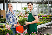 Garden centre salesman and customer