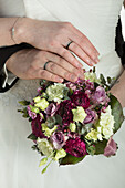 Bridal bouquet, hands with rings