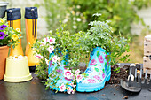 Upcycling - plants in rubber boots