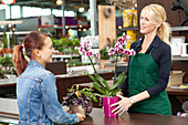 Saleswoman advises customer