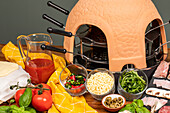 Mini pizza oven with ingredients