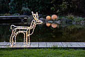 Lights in the garden - Moose made of rope light