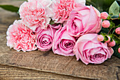 Cut flowers on a wooden background