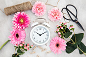 Alarm clock and cut flowers