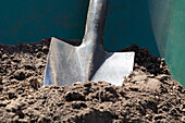 Wheelbarrow with shovel