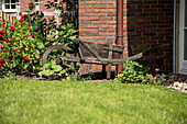 Garden decoration - Peat barrow in a flowerbed