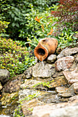 Water feature with clay jug
