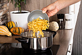 Pumpkin noodles - add noodles to pot