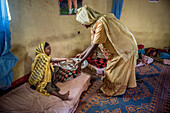 Health worker serving coffee