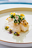 Turbot with vegetables and edible flowers