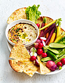 Baked herb ricotta with raw vegetables and flatbread