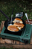 Sweet brioche buns with chocolate cream and vanilla cream