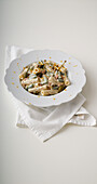 Tortiglioni with tuna, eggs, beans, capers and orange cream