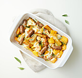 Potato pan with pumpkin, sausage and provola from the oven