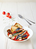 Tomato soup with fish, mussels and toasted bread