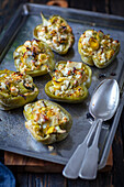 Baked pepper halves stuffed with feta and leek