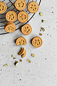 Pistachio biscuits in the shape of buttons
