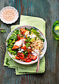 Buddha bowl with roasted sweet potatoes, avocado and tomatoes