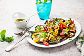 Grilled aubergine and tomato salad
