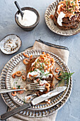 Blinis with crème fraiche and prawns