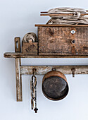 Vintage wall shelf with bobbins, ropes and rosaries