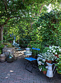 Idyllic garden area with flowering plants and seating