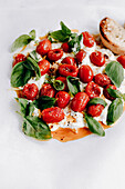 Burrata with cherry tomatoes, garlic, olive oil and basil