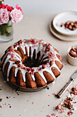 Chocolate cake with rose petals and icing