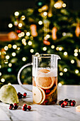 Christmas punch with oranges, cranberries and pears