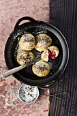 Vegan cherry dumplings with poppy seed sugar