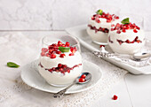 Vegan quark cream pomegranate dessert in a jar