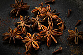 Star anise on a black surface