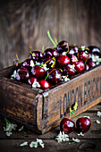 Wooden box with fresh cherries
