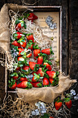 Fresh strawberries in a wooden crate