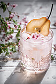 Pink gin with mallow blossom and pear