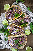 Tuna tacos with coleslaw and lime