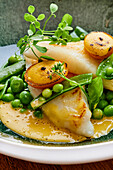 St Peter's fish fillet with peas and kumquat