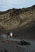 Volcan del Cuervo (Crow volcano) a crater explored by a loop trail in a barren, rock-strewn landscape