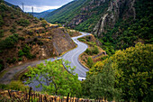 N116 road meandering and parallel to The Yellow Train or Train Jaune, Pyrénées-Orientales, Languedoc-Roussillon, France.