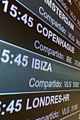 Departure information boards in Madrid Airport, Spain