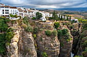 Landscape of white houses from Puente Nuevo new bridge and El Tajo Gorge, Ronda, Andalucia, Spain