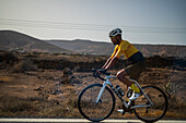 Cyclist in road, Haria, Lanzarote, Canay Islands, Spain