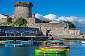 Le fort Vauvan de Socoa and the fishing harbour of Ciboure, Basque country. France Small coloreful fish boats on the old port of cituadel in front of Saint Jean de luz.