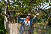 Elevated canopy walk hanging bridges. A rain forest canopy walkway in the Amazon forest tambopata national park, at the Inkaterra amazonica reserve. Visitors have a birds eye view from the Amazon jungle canopy walkway at river napo camp Explorama tours in Peru. Iquitos, Loreto, Peru. The Amazon Canopy Walkway, one of the longest suspension bridges in the world, which will allow the primary forest animals from a height of 37 meters and is suspended over the 14 tallest trees in the area.