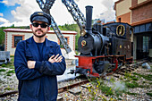 Driver of the steam train, Utrillas mining train and Utrillas Mining and Railway Theme Park, Utrillas, Cuencas Mineras, Teruel, Aragon, Spain.